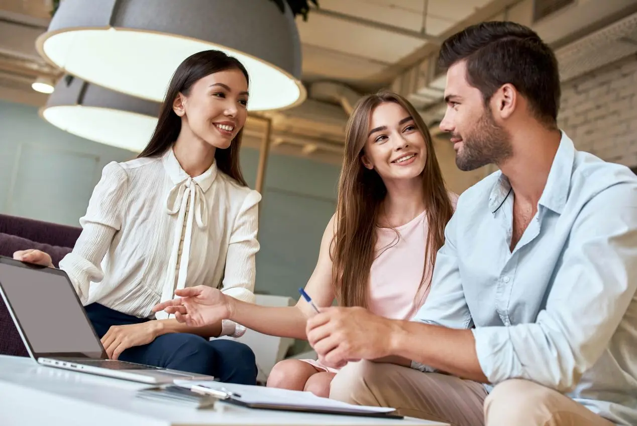 young-couple-in-a-tour-agency-decide-with-a-travel-2023-11-27-04-51-25-utc