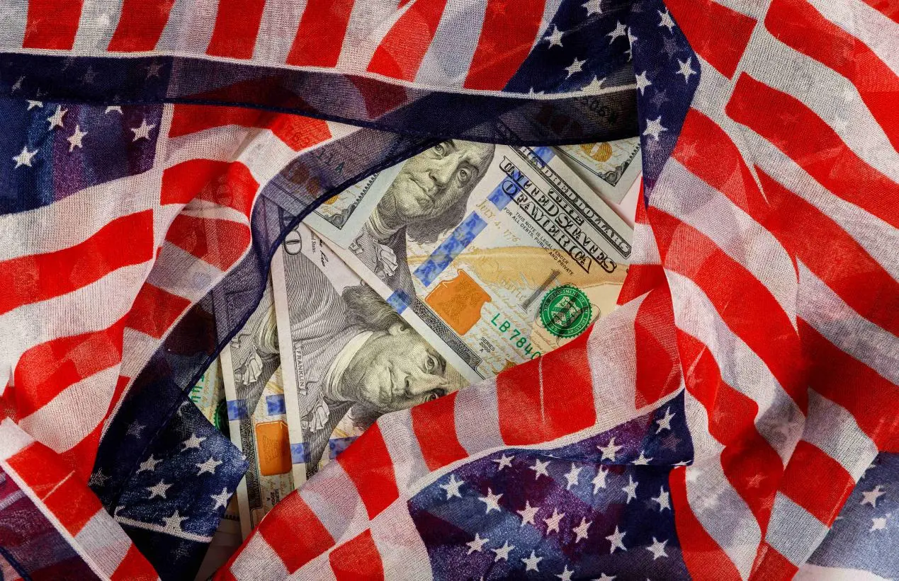 us-100-dollars-wrapped-in-the-us-flag-2025-03-27-03-35-05-utc